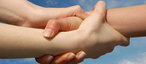 Helping Hands against blue sky