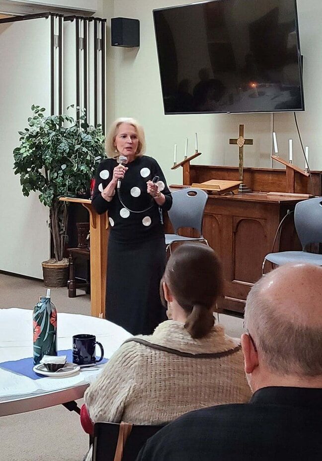 Amy Sander Montanez speaking to a group